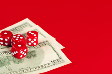 Playing Dices and Stack of American Dollars Bills.