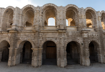 Naklejka premium The Roman Amphitheater in the old town of Arles in Provence in the South of France.