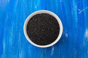 seeds of black sesame in the white bowl