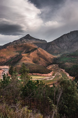 Fototapeta na wymiar Mountain peak with river bed in foreground