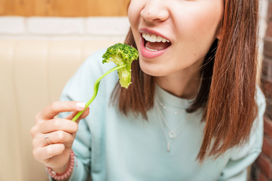 Happy Woman Eating Healthy Broccoli Salad