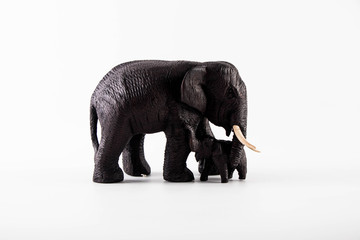 Fototapeta premium Elephant family carved from wood