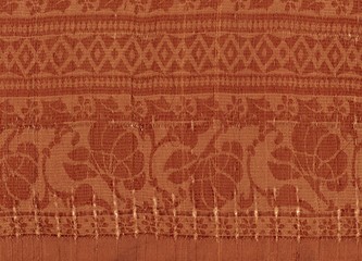 Fototapeta na wymiar Fond orange textile à motifs abstraits