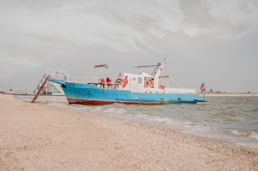 Blue tourist ship at the pier in Yeisk braid island