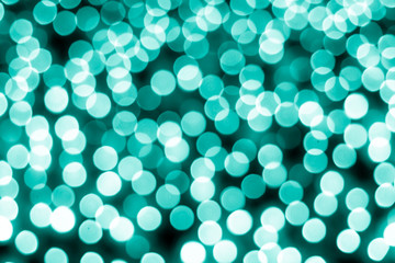 Abstract bokeh background. Soft defocused lights. Neon basic cyan color