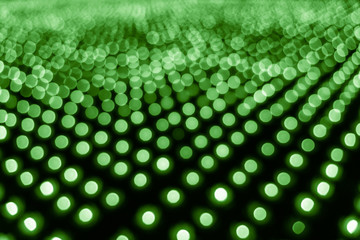 Abstract bokeh background. Soft defocused lights. Neon basic green color