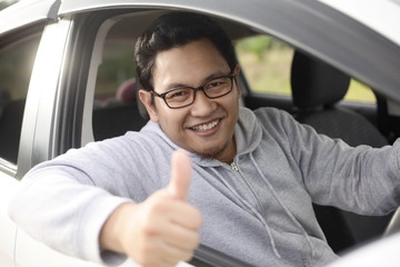 Happy Driver Shows Thumb Up and Smile