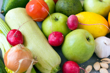 vegetables and fruits, red radish, green apples, zucchini, lemon, onion, green avocado, garlic, tomato