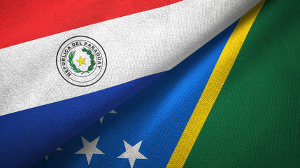 Paraguay and Solomon Islands two flags textile cloth, fabric texture