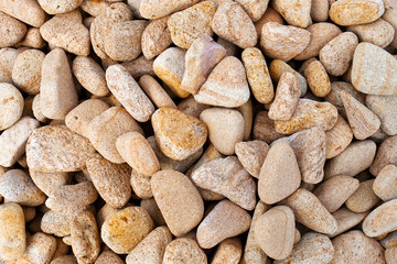 Beige gravel stone floor texture background