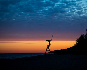 Sunset on a Mediterranean beach, next to a coastal surveillance post