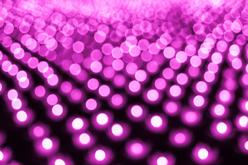 Abstract bokeh background. Soft defocused lights. Neon basic pink color