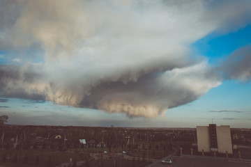 Storm clouds above the ground. Art processing. Storm clouds and sky.