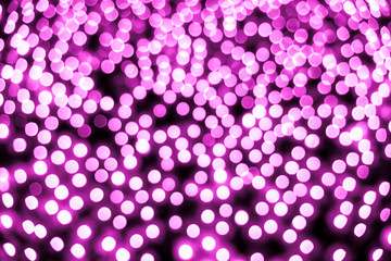 Abstract bokeh background. Soft defocused lights. Neon basic pink color