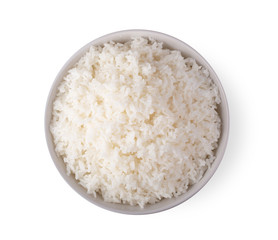 Fototapeta na wymiar Rice in a white bowl on a white background. top view