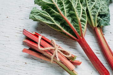  fresh rhubarb on a wooden background