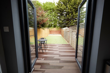View to the garden from the back door of a refurbished house