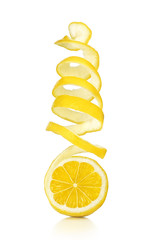 The lemon skin is twisted in a spiral with reflection on an isolated white background