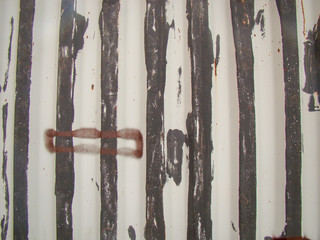 Background. Old metal wall with fins. Steel is visible close by. The interior surfaces are...