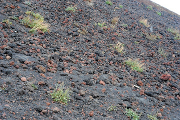 slope of a volcano with stones