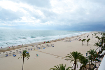 Obraz premium Playa de cullera. Amanecer nublado en la playa