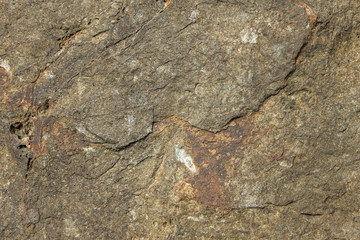 gray porous surface of stone rock with deep relief close-up. natural texture