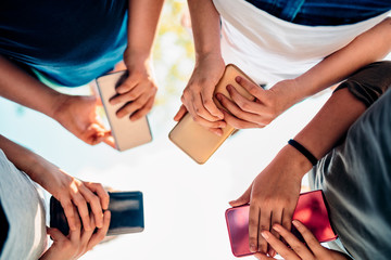 Kids playing video games on smart phone after school