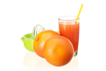 Glass of fresh grapefruit juice, juicer and grapefruit fruits on white background