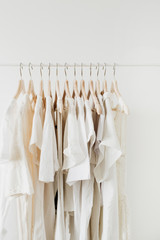 Feminine clothes on hanger. Minimal fashion composition on white background.