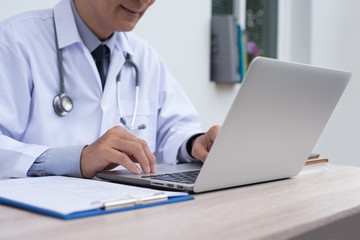 Doctor working on laptop computer