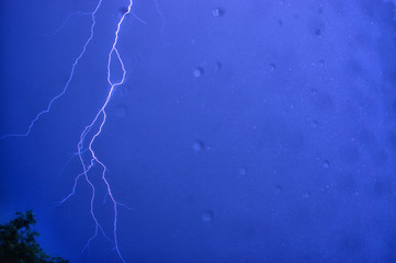 storm lightning through the window