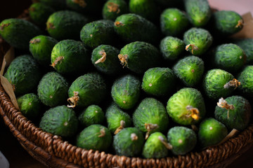 fresh green crisp cucumbers in a wooden basket. The spring avitaminosis