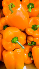 Closeup abstract image of lots of paprica peppers. Texture of bell peppers