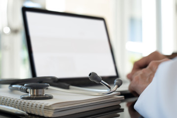 Doctor working on laptop computer
