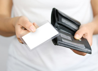 woman in white shirt with empty paper and wallet