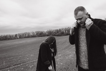 Atmospheric Portrait of a girl with a guy on the subject: parting, racking up, depression, longing,...