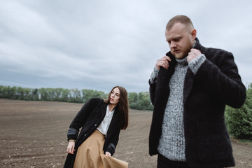 Atmospheric Portrait of a girl with a guy on the subject: parting, racking up, depression, longing,...