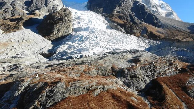 4k aerial dolly out of glacial ice fall in Langtang Valley in Nepal