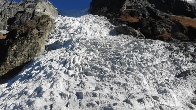 4k aerial fly left to right over glacial ice fall in Langtang Valley in Nepal