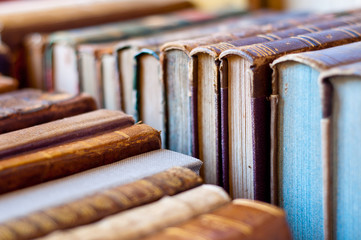 Books background. Old leather covered books