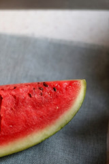 Fototapeta na wymiar Cut watermelon on a table. Selective focus.