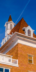 Vertical Exterior view of a building against vibrant blue sky on a bright sunny day