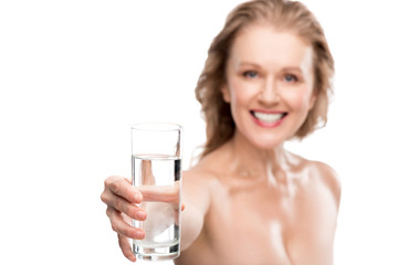 smiling mature woman with glass of water Isolated On White
