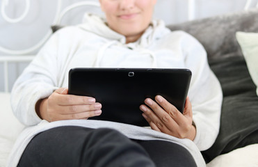 woman is surfing with tablet 