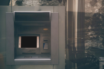 The ATM is in the department store.