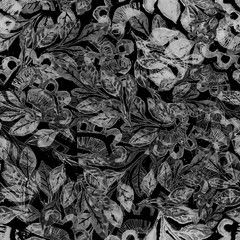 abstract floral ornament of dark gray and light gray drawn on a dark background