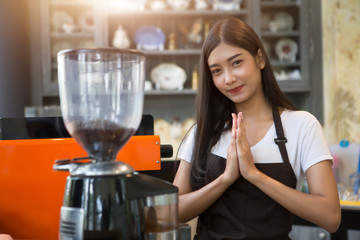 Coffee maker with staff being used. Employees working with coffee makers.