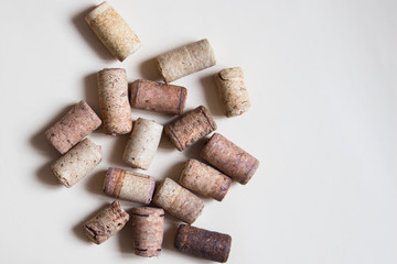 Set of wine cork stoppers on beige background. Top view.