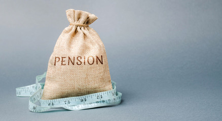 Money bag with the word Pension and tape measure. Fall / reduction pension payments. Retirement....