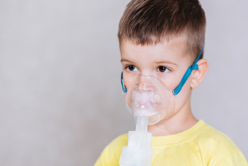 small child treats bronchitis inhaler at home